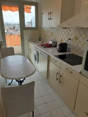 a kitchen with a table and a sink and a table and a table at Cannes Satellite in Cannes
