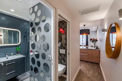 a bathroom with a toilet and a sink at Luxury Family 2BR - Prime Location, Walk to Beach & Shopping, Sunny Balcony - By Totolulu Cannes Hoche in Cannes