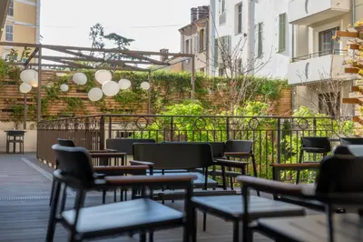 a row of chairs sitting on a patio at Nemea Appart Hotel Cannes Palais in Cannes