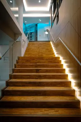 a staircase in a building with wooden steps at Nemea Appart Hotel Cannes Palais in Cannes