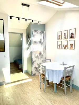 a dining room with a table and chairs at Safari apartment in heart of Cannes and beaches in Cannes