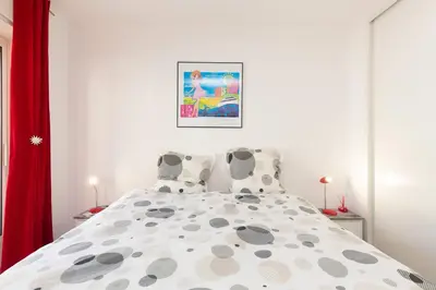 a bedroom with a bed with two pillows at Villa AD’ALTA in Cannes