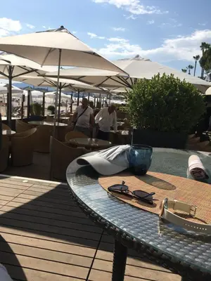 a table with a pair of glasses on top of it at Croisette View Lux Flat Cannes in Cannes