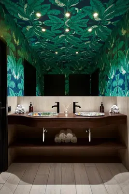 a lobby with two blue chairs and a counter at Hotel Verlaine in Cannes