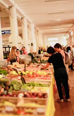 a group of people in a market with fruits and vegetables at 70m2 Apartment - La Roseraie in Cannes