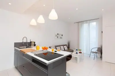 a kitchen with a sink and a counter top at Nature 2 pièces 3 étoiles calme plein centre cannes 5 mn des plages et Palais in Cannes