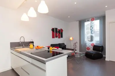 a kitchen with a sink and a counter top at 7e Art 2 pièces 3 étoiles calme plein centre Cannes 5mn plages et Palais in Cannes