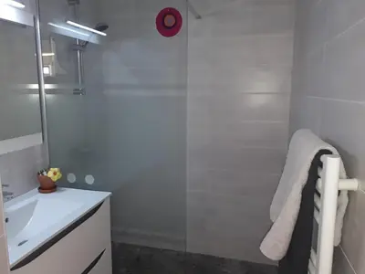 a bathroom with a shower and a sink at Le Tivoli in Cannes