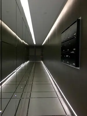 a hallway of a building with lights on the wall at Appartements Urban et Pure in Cannes