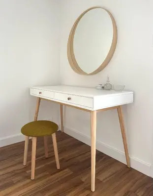 a dressing table with a mirror and a stool at Appartement rénové CANNES, palm beach in Cannes