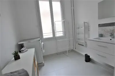 a small white bathroom with a sink and a sink at RUE D'ANTIBES CENTER in Cannes