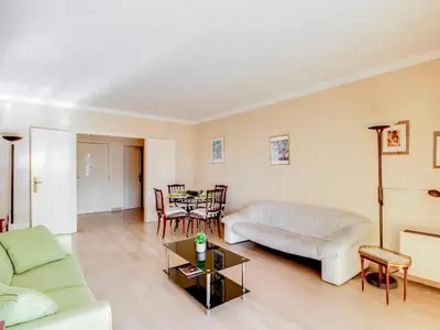 a living room with a couch and a table at Apartment Les Hortensias by Interhome in Cannes