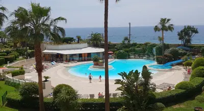 an overhead view of a pool at a resort at Sea view La Palme d'Azur apartment steps away from the beach and perfect for holidays & business trips in Cannes