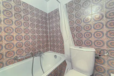 a bathroom with a toilet and a bath tub at IMMOGROOM - Studio - Sea view next to the Palais - CONGRESSBEACHES in Cannes