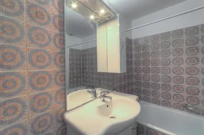 a bathroom with a sink and a mirror at IMMOGROOM - Studio - Sea view next to the Palais - CONGRESSBEACHES in Cannes