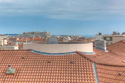 a view of the roof of a building at IMMOGROOM - Studio - Sea view next to the Palais - CONGRESSBEACHES in Cannes
