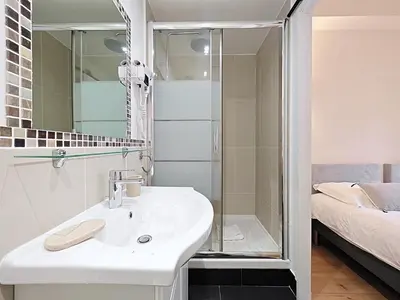 a bathroom with a sink and a shower at Croisette carre d'or in Cannes