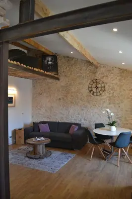 a living room with a couch and a table at 2 pièces Vagliano in Cannes