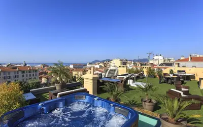 a hot tub on the roof of a building at Residence du Louvre - Apartments - Prime location Palais & Croisette - Luxury Stay by LRA Cannes in Cannes