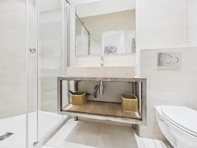 a bathroom with a sink and a shower at Residence du Louvre - Apartments - Prime location Palais & Croisette - Luxury Stay by LRA Cannes in Cannes