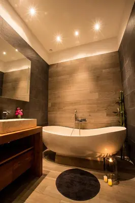 a large bathroom with a tub and a sink at Residence du Louvre - Apartments - Prime location Palais & Croisette - Luxury Stay by LRA Cannes in Cannes