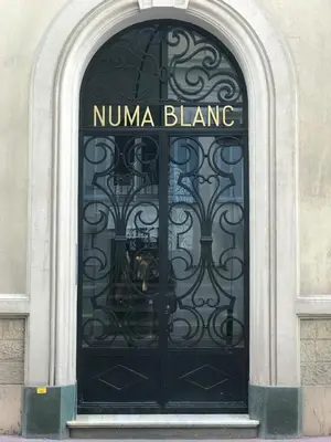 a black door with the words nuna blane on it at NUMA BLANC 300 M PALAIS DES FESTIVALS in Cannes