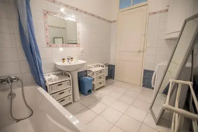 a hotel room with two beds and a window at Bohemian Apartment by Connexion in Cannes