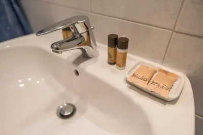 a bathroom with a sink and a bath tub next to a sink at Bohemian Apartment by Connexion in Cannes