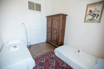 a living room with a television and a table and chairs at Bohemian Apartment by Connexion in Cannes