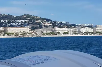 a view of a city from a boat in the water at PALAIS MIRAMAR CROISETTE APART 1 MIN CARLTON in Cannes