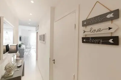 a hallway with a door and signs on the wall at PALAIS MIRAMAR CROISETTE APART 1 MIN CARLTON in Cannes