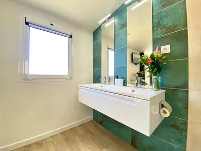 a bathroom with a sink and a mirror at Luxury 