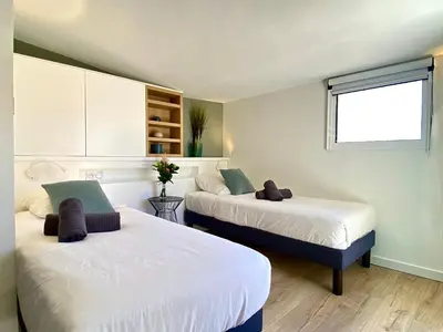 a room with two beds and a window at Luxury 