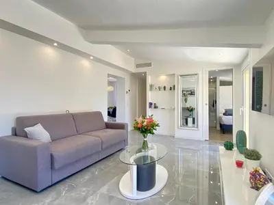 a living room with a couch and a glass table at Luxury 