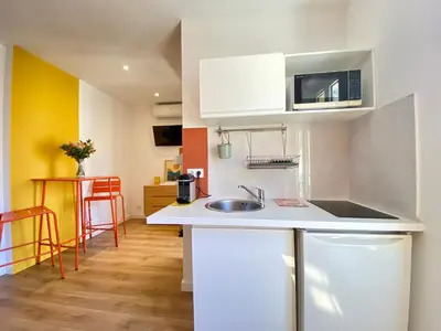 a small kitchen with a sink and a microwave at Studio Luxury Toîts du Soleil By SCLS Locations in Cannes