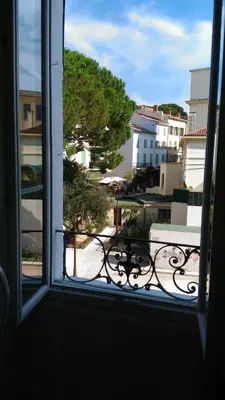an open window with a view of a balcony at Saint Dizier in Cannes