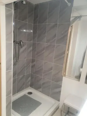 a shower with a glass door in a bathroom at Saint Dizier in Cannes