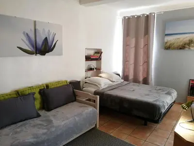 a bedroom with a bed and a couch at Saint Dizier in Cannes