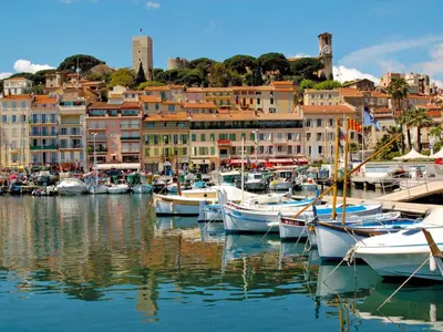 a group of boats docked in a harbor with buildings at Apartment Villa Schneider by Interhome in Cannes