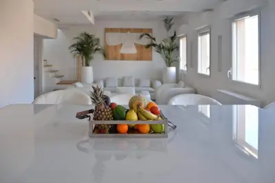 a bowl of fruit on a table in a living room at Hôtel Traverse Des Artistes in Cannes