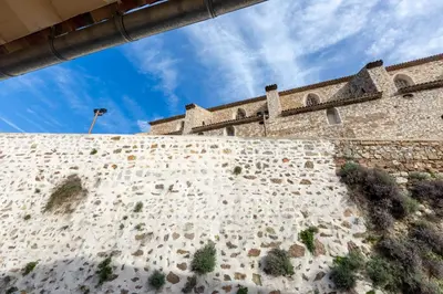 a view of the wall of a castle at Hôtel Traverse Des Artistes in Cannes