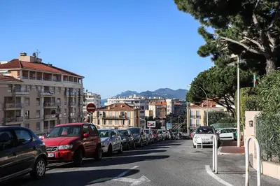 a city street filled with lots of parked cars at ACCI Cannes Les Yuccas in Cannes