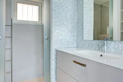 a bathroom with a sink and a mirror at IMMOGROOM - 3 Sea view Panoramic terrace - 1 min beach - CONGRESSBEACH in Cannes
