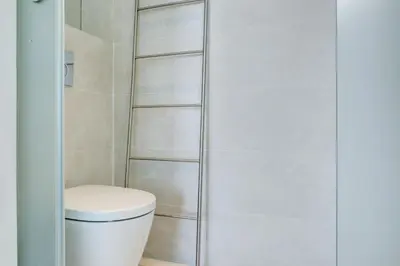 a bathroom with a toilet and a shower at IMMOGROOM - 3 Sea view Panoramic terrace - 1 min beach - CONGRESSBEACH in Cannes