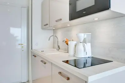 a kitchen with a sink and a counter top at IMMOGROOM - 3 Sea view Panoramic terrace - 1 min beach - CONGRESSBEACH in Cannes