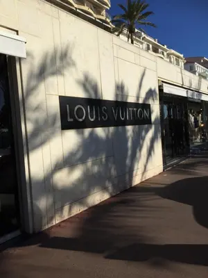 a building with a louis vuitton sign on it at Appartement Belle Azur in Cannes