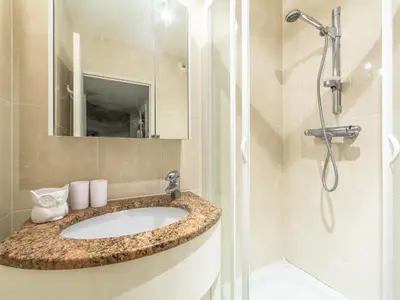 a bathroom with a sink and a shower at Apartment Cristal Croisette-1 by Interhome in Cannes