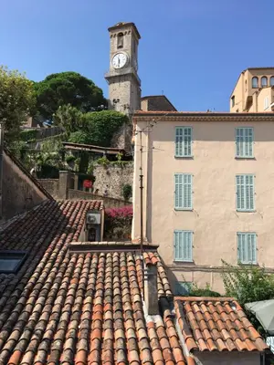 a clock tower on top of a building at Appart Suquet Avec Terasse Vue Mer in Cannes