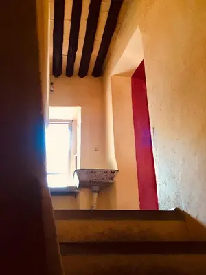 a stairway with a window and a rainbow in a building at Appart Suquet Avec Terasse Vue Mer in Cannes