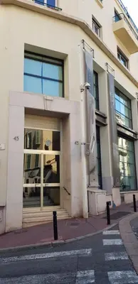a building on a street in front of a building at 45 Clemenceau by Welcome to Cannes in Cannes